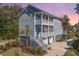 Stunning three-story home featuring a double-balcony and a well-maintained yard at 2322 Dorado Ct, Johns Island, SC 29455