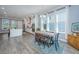 Bright open kitchen featuring a dining area, white cabinetry, and modern appliances at 2322 Dorado Ct, Johns Island, SC 29455
