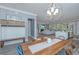 Open-concept living area with dining table, TV, and fireplace at 2322 Dorado Ct, Johns Island, SC 29455