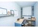 Cozy home office with a built-in desk, shelving, and natural light from a window at 2322 Dorado Ct, Johns Island, SC 29455