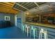 Cool outdoor bar with seating, string lights, and fun decor for entertaining guests at 2322 Dorado Ct, Johns Island, SC 29455