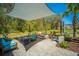 Relaxing covered patio with comfortable seating, a stone fire pit, and a beautiful view at 2322 Dorado Ct, Johns Island, SC 29455