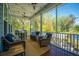 Outdoor screened-in porch with pond views, comfortable seating and beautiful string lights at 2322 Dorado Ct, Johns Island, SC 29455