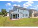 The backyard features a covered patio with sliding glass doors and a spacious lawn at 234 Silk Oak Dr, Moncks Corner, SC 29461