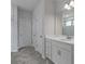 Bright bathroom with double vanity, stylish lighting and modern fixtures at 234 Silk Oak Dr, Moncks Corner, SC 29461