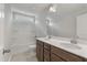 Stylish bathroom featuring dual sinks, wood cabinets and a shower-tub, creating a functional and modern space for relaxation at 234 Silk Oak Dr, Moncks Corner, SC 29461
