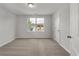 Inviting bedroom features neutral carpeting and a bright window, creating a comfortable and peaceful retreat at 234 Silk Oak Dr, Moncks Corner, SC 29461