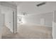 Expansive bonus room offers neutral carpeting and a ceiling fan, creating a welcoming and adaptable area for various activities at 234 Silk Oak Dr, Moncks Corner, SC 29461