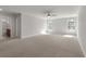 Spacious bonus room boasts neutral carpeting, sunlit windows and easy access to a bathroom, creating a comfortable and versatile space at 234 Silk Oak Dr, Moncks Corner, SC 29461
