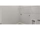 Functional laundry room with ample electric outlets, hookups, and wire shelf for extra storage and convenience at 234 Silk Oak Dr, Moncks Corner, SC 29461