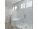 Modern bathroom shower with glass doors, white tile and built-in bench at 234 Silk Oak Dr, Moncks Corner, SC 29461