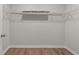 Spacious walk-in closet with wire shelving and wood-look flooring; ample storage space for an organized wardrobe at 234 Silk Oak Dr, Moncks Corner, SC 29461