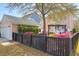 Landscaped backyard featuring flowering shrubs, a black fence, and view of the home's exterior at 2353 Eagle Creek Dr, Charleston, SC 29414