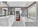 Luxurious bathroom with a double sink vanity, standalone tub, and a seamless glass shower at 2353 Eagle Creek Dr, Charleston, SC 29414