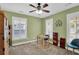 Cozy bedroom features neutral carpet, bright windows, and a ceiling fan at 2353 Eagle Creek Dr, Charleston, SC 29414