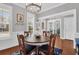 Elegant dining room featuring modern lighting, hardwood floors, and a cozy ambiance at 2353 Eagle Creek Dr, Charleston, SC 29414