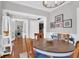 Elegant dining room featuring modern lighting, hardwood floors, and a cozy ambiance at 2353 Eagle Creek Dr, Charleston, SC 29414