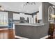 Modern kitchen boasts white cabinets, granite countertops, stainless steel appliances, and hardwood floors at 2353 Eagle Creek Dr, Charleston, SC 29414