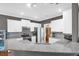 Well-lit kitchen featuring stainless steel appliances, white cabinets, and granite countertops at 2353 Eagle Creek Dr, Charleston, SC 29414