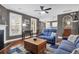 Comfortable living room with a fireplace, natural light and hardwood flooring at 2353 Eagle Creek Dr, Charleston, SC 29414