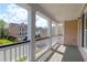 A spacious front porch features white columns, wood decking, and neighborhood views at 2353 Eagle Creek Dr, Charleston, SC 29414
