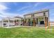 Large backyard with a covered patio, pergola, outdoor grill, and seating area, great for entertaining at 243 N Light Way, Summerville, SC 29486