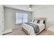 Cozy bedroom featuring a comfortable bed, soft carpet, and ample natural light through a window at 243 N Light Way, Summerville, SC 29486