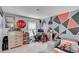 Unique bedroom design featuring geometric mural, decor, desk, and modern furniture at 243 N Light Way, Summerville, SC 29486