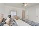 Bright bedroom featuring a dresser with a mirror and a cozy bed with decorative pillows at 243 N Light Way, Summerville, SC 29486