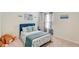 Bright and inviting bedroom with coastal decor and comfortable blue accents at 243 N Light Way, Summerville, SC 29486