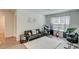 Cozy living room with comfortable seating, stylish decor, and plenty of natural light at 243 N Light Way, Summerville, SC 29486