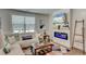 Cozy living room with a modern fireplace, comfortable seating, and stylish decor at 243 N Light Way, Summerville, SC 29486