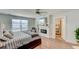 This light-filled main bedroom features a fireplace, TV, and spa-like bathroom at 243 N Light Way, Summerville, SC 29486