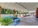 Spacious covered patio with comfortable seating, table, and relaxing hammocks, perfect for leisure at 243 N Light Way, Summerville, SC 29486