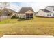 Spacious backyard featuring a screened-in porch and lush lawn at 2431 Thoreau Ln, Charleston, SC 29406