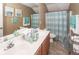 Inviting bathroom featuring a double sink vanity, shower with curtain, and modern decor at 2431 Thoreau Ln, Charleston, SC 29406