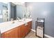 Bathroom featuring a double vanity with sinks, large mirror, and tile flooring at 2431 Thoreau Ln, Charleston, SC 29406