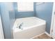 Bright bathroom featuring a soaking tub with chrome faucet at 2431 Thoreau Ln, Charleston, SC 29406