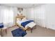 Bright, stylish bedroom featuring a bed, blue accents and large windows at 2431 Thoreau Ln, Charleston, SC 29406