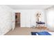 Bedroom with neutral walls, carpet, white trim and a desk in the corner at 2431 Thoreau Ln, Charleston, SC 29406