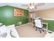 Bedroom features green accent wall, white day bed, and ceiling fan at 2431 Thoreau Ln, Charleston, SC 29406