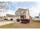 Charming two-story home with a well-maintained lawn and attached garage, inviting curb appeal at 2431 Thoreau Ln, Charleston, SC 29406