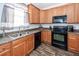 Well-lit kitchen featuring wood cabinets, stainless steel appliances, and a functional layout perfect for cooking at 2431 Thoreau Ln, Charleston, SC 29406