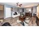 Spacious living room featuring a white leather couch, modern furnishings, and wood-look floors at 2431 Thoreau Ln, Charleston, SC 29406