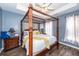 Serene main bedroom with a four-poster bed, ceiling fan, and soft lighting, creating a relaxing retreat at 2431 Thoreau Ln, Charleston, SC 29406