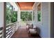 Cozy balcony seating offers a tranquil space to enjoy views of lush greenery at 2501 Clear Marsh Rd, Seabrook Island, SC 29455