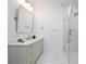 Modern bathroom with dual vanity, large mirror, shower, and stylish tile flooring at 2501 Clear Marsh Rd, Seabrook Island, SC 29455
