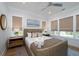 Cozy bedroom with natural lighting, neutral color scheme and ceiling fan at 2501 Clear Marsh Rd, Seabrook Island, SC 29455