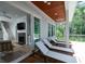 Relaxing outdoor deck featuring wood ceiling, ceiling fans, and comfortable chaise lounges at 2501 Clear Marsh Rd, Seabrook Island, SC 29455
