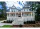 Beautiful two-story home with inviting front porch and manicured landscaping at 2501 Clear Marsh Rd, Seabrook Island, SC 29455